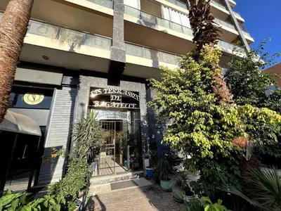 a building with a sign on the front of it at Luxury apartment in center of gueliz in Marrakech