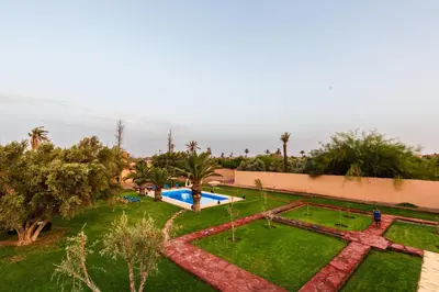 an aerial view of a garden with a swimming pool at Villa Warhol Marrakech in Marrakech