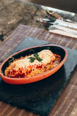a bowl of food on a plate on a table at Villa Warhol Marrakech in Marrakech