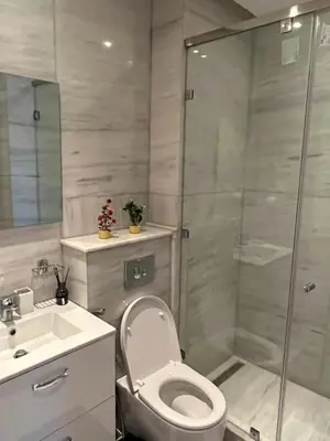 a bathroom with a toilet and a shower and a sink at Appt Premium 3 rooms with big terrace at Prestigia Marrakech in Marrakech