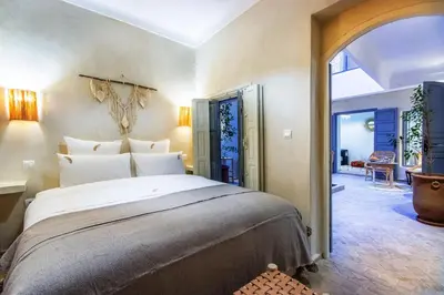 a bedroom with a large bed in a room at Riad Berrima - Breakfast - 10mn from Jamaa Al Fna in Marrakech