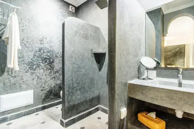 a bathroom with a sink and a mirror at Riad Berrima - Breakfast - 10mn from Jamaa Al Fna in Marrakech