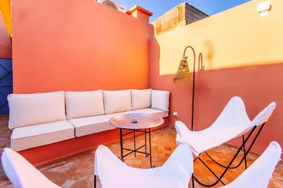 a living room with a couch and chairs at Riad Berrima - Breakfast - 10mn from Jamaa Al Fna in Marrakech