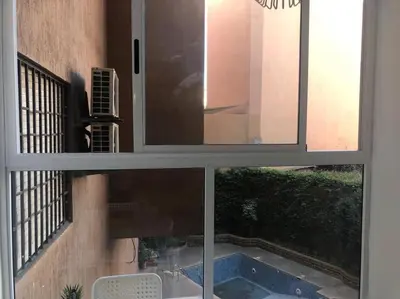 a view of a window with a view of a courtyard at appartement center de Guéliz avec piscine in Marrakech
