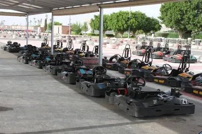 a row of race cars parked in a parking lot at Villa Gardens Diafa in Marrakech