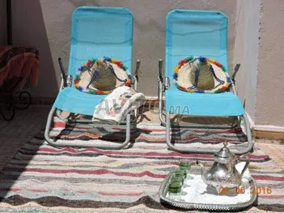 two blue chairs sitting on top of a rug at appartement Bahia jame el fna in Marrakech