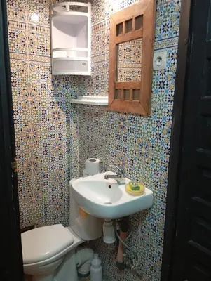 a bathroom with a sink and a toilet at appartement Bahia jame el fna in Marrakech