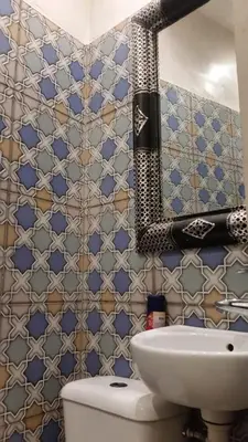 a bathroom with a toilet and a sink at appartement Bahia jame el fna in Marrakech