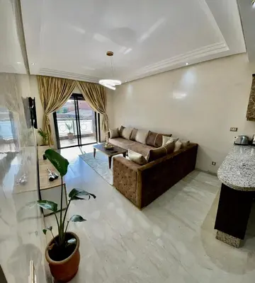 a living room with a couch and a table at Golden house in Marrakech