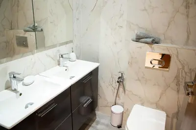 a bathroom with a sink and a toilet at A Place To Call Home - Downtown in Marrakech