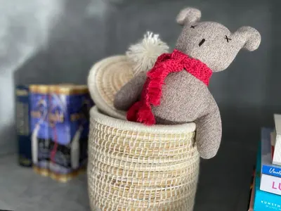 a stuffed animal sitting on top of a basket at YVES Marrakech in Marrakech