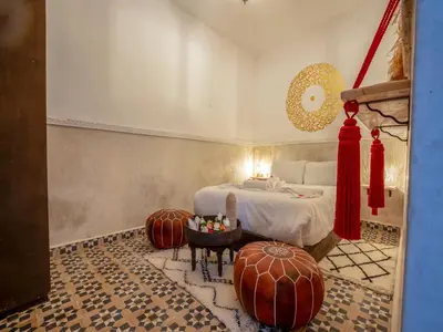 a bedroom with a bed and two large pumpkins at Riad HAFSSA & Spa in Marrakech