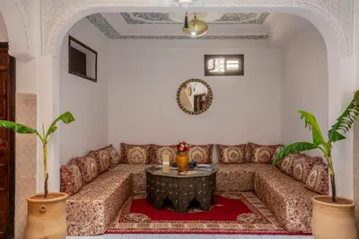 a living room with a couch and a table at Riad HAFSSA & Spa in Marrakech