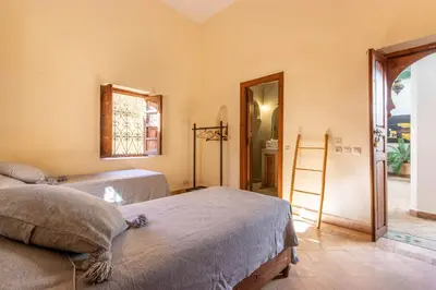 a room with two beds and a ladder in it at Riad Dar Al Barakaa - EXCLUSIVE - Breakfast in Marrakech