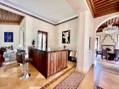 a home office with a desk and a chair in a room at Majestic Luxury Villa Marrakech in Marrakech