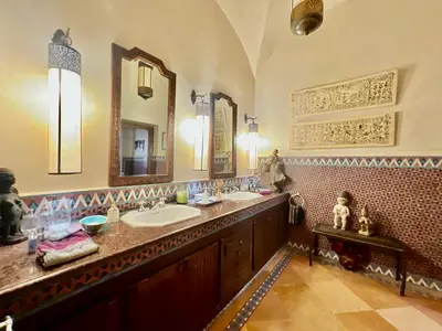 a bathroom with two sinks and a large mirror at Majestic Luxury Villa Marrakech in Marrakech