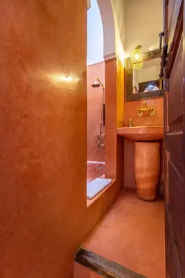 a bathroom with a sink and a mirror at Riad El Faris Exclusif-Included Moroccan Breakfast in Marrakech