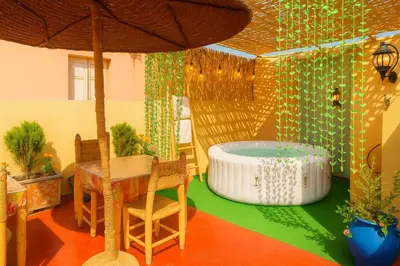 a room with a jacuzzi tub in a house at Riad Safran Rouge Jacuzzi RoofTop in Marrakech