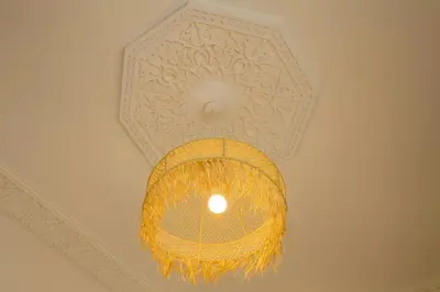 a yellow light hanging from a ceiling at Riad Safran Rouge Jacuzzi RoofTop in Marrakech