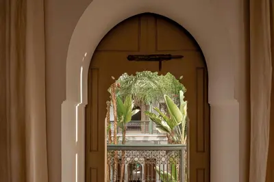 an archway with a window with a plant in it at Riad Jaaneman in Marrakech