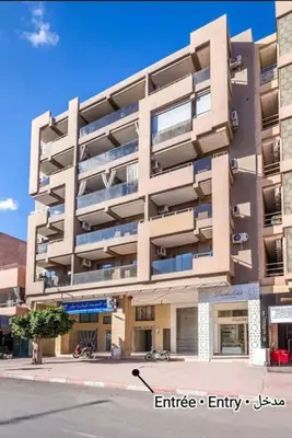 a large apartment building on a city street at Plein centre Marrakech, grand balcon filant in Marrakech