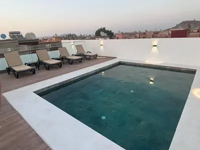 a swimming pool on the roof of a house at Villa zéphyr in Marrakech