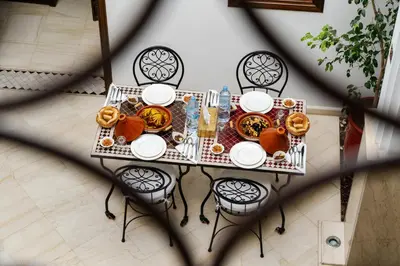 a table with plates of food on top of it at Riad Mandana & Spa in Marrakech