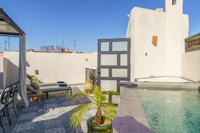 a house with a swimming pool on a patio at Riad AJI 4 Rooms, Pool, Internet, Top Emplacement Médina in Marrakech