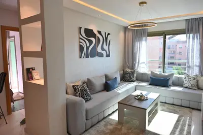 a living room with a couch and a table at Apartment for Rent Luxury Stay Near to Jemaa el-Fnaa in Marrakech