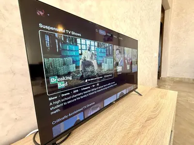 a large flat screen tv sitting on a wooden table at Beach Mama Waky Marrakech Appartement Premium Piscine & Vue Atlas in Marrakech