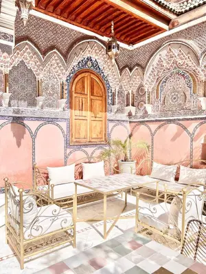a dining room with a table and chairs at Riad Azad & Spa in Marrakech