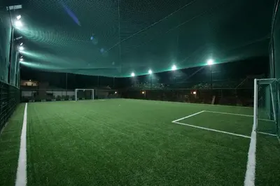 an empty soccer field in a stadium at night at El Olivar Palace Marrakech All Inclusive, Aquapark & SPA in Marrakech