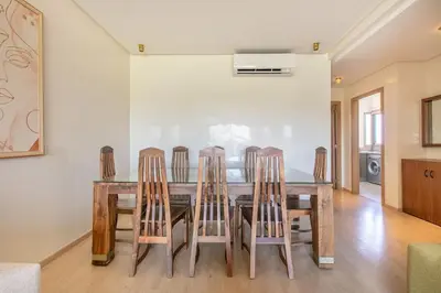 a dining room with a table and four chairs at Résidence golfique, jardin, piscine in Marrakech