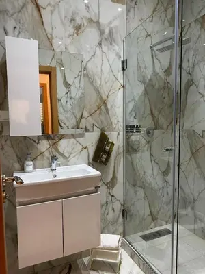 a bathroom with a sink and a shower at Appartement propre au centre de Marrakech in Marrakech