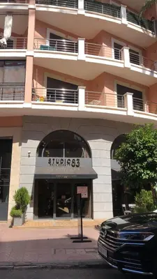 a car parked in front of a building at studio avec terasse carre eden iptv wifi in Marrakech