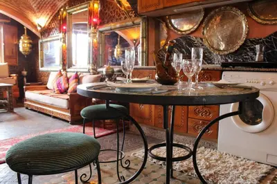 a room with a table with wine glasses on it at Atypical functional flat Gueliz close Garden Harti in Marrakech