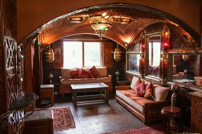a living room with a couch and a table at Atypical functional flat Gueliz close Garden Harti in Marrakech