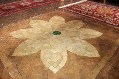 a tiled floor with a picture of a flower on it at Atypical functional flat Gueliz close Garden Harti in Marrakech