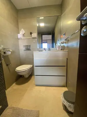 a small bathroom with a toilet and a sink at Superbe pied à terre sur Majorelle in Marrakech