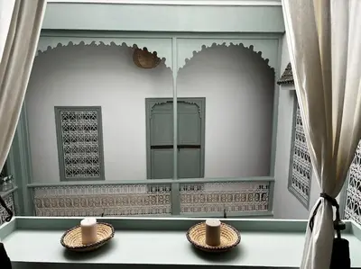 a room with a mirror and two bowls on a table at Riad Nadara, superbe riad au coeur de la medina! in Marrakech