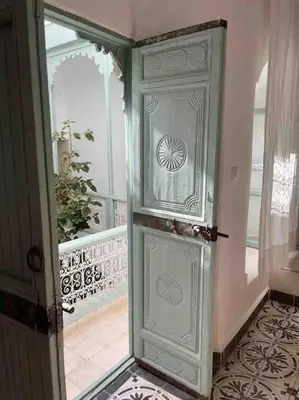 an open door to a room with a staircase at Riad Nadara, superbe riad au coeur de la medina! in Marrakech
