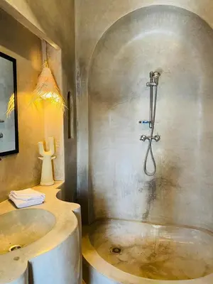 a bathroom with a tub and a sink and a shower at Riad Casa nomad in Marrakech
