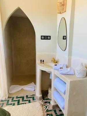 a bathroom with a sink and a mirror at Riad Casa nomad in Marrakech
