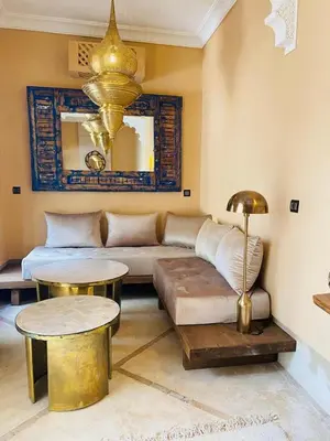 a living room with a couch and a table at Riad Casa nomad in Marrakech