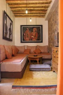 a living room with a couch and a table at Atypique appart proche J. El fna in Marrakech