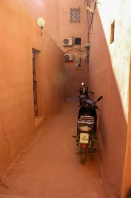 a motor bike parked in an alley way at Atypique appart proche J. El fna in Marrakech