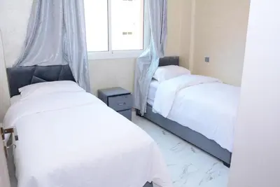 a bedroom with two beds and a window at apartment Marrakech, gueliz in Marrakech