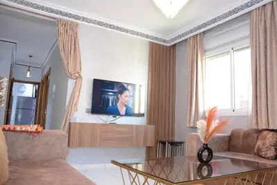a living room with a tv on a wall at apartment Marrakech, gueliz in Marrakech