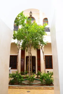 a building with trees in front of it at Riad Dar Zaouia in Marrakech
