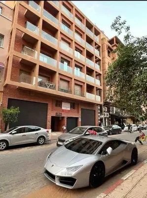 a silver car parked in front of a building at Nid douillet à Gueliz in Marrakech